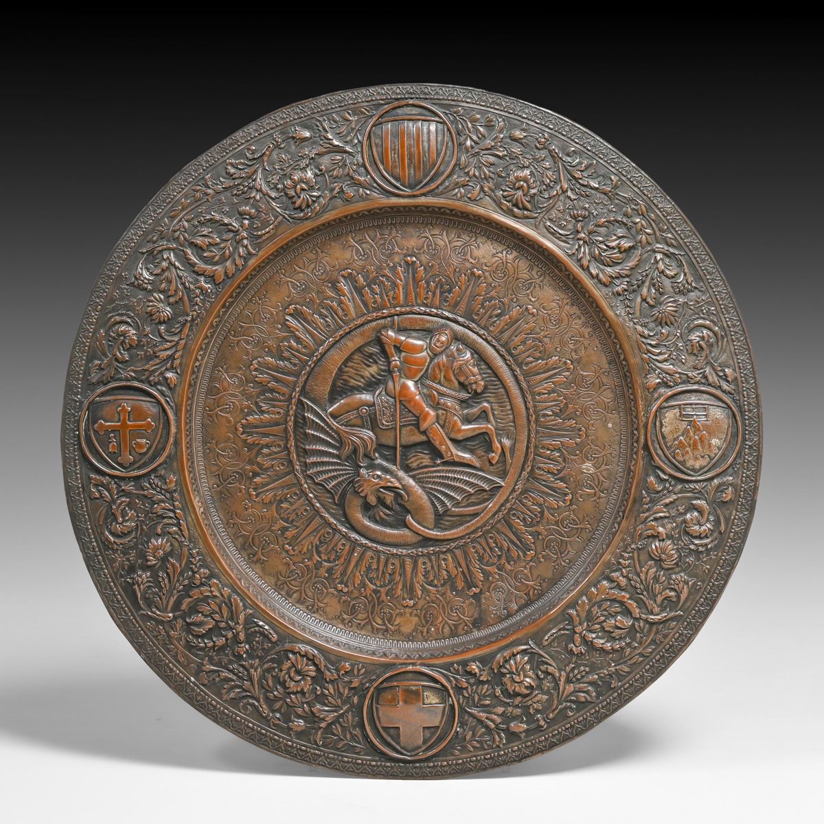 Large 20”d Spanish Renaissance-Revival Embossed Copper Wall Charger – St George & the Dragon c1910